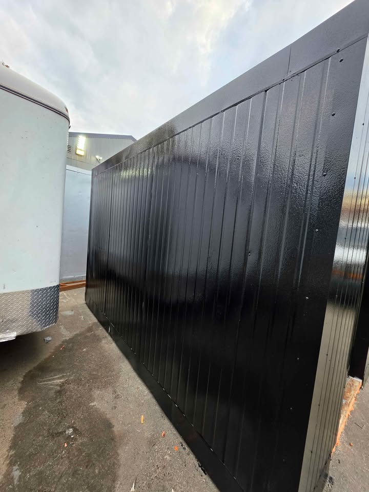 The long side of the black walk-in freezer